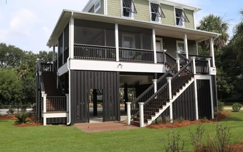 Raised Edisto Island rental home with a large green lawn